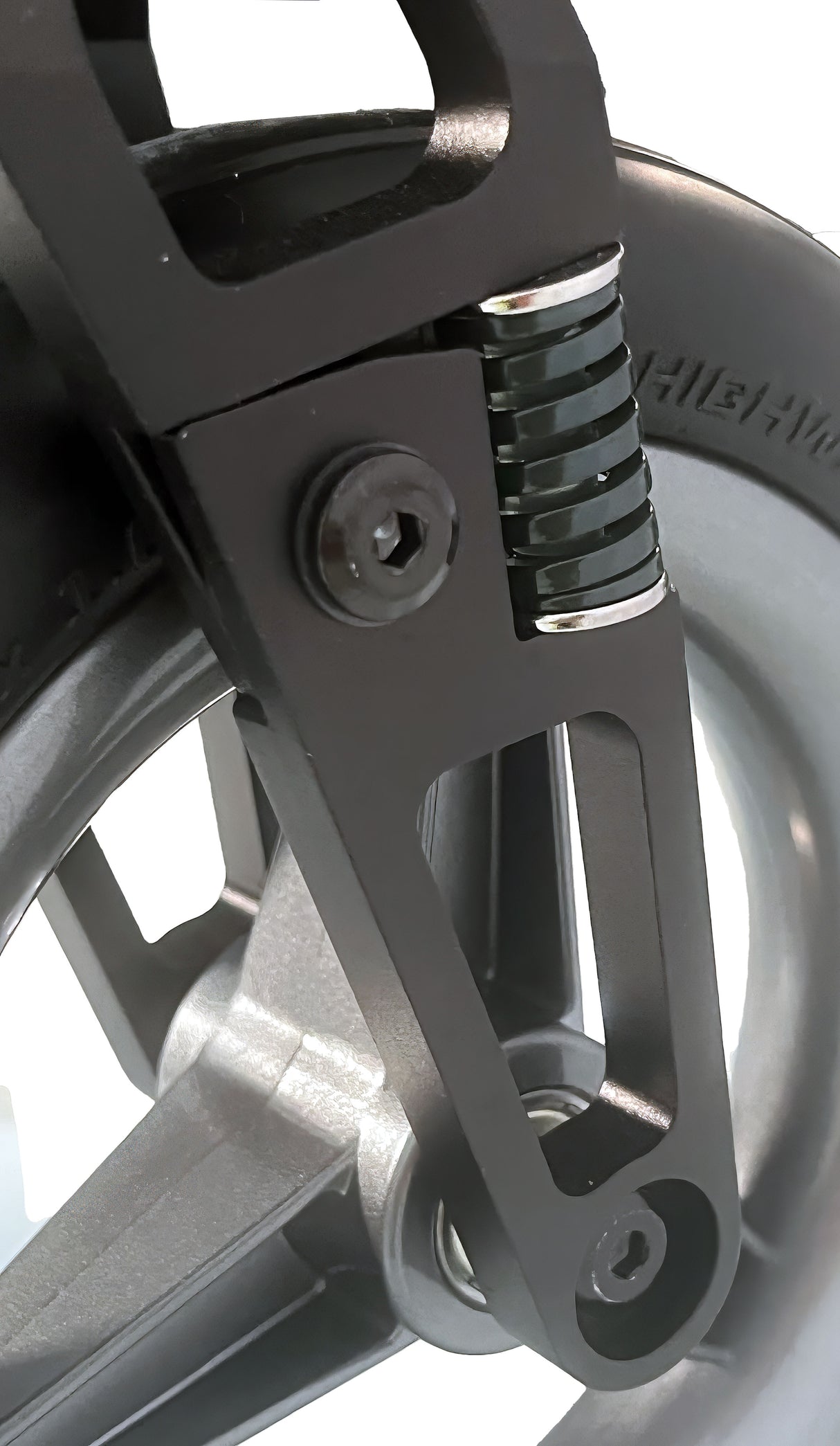Close-up of a wheelchair wheel with suspension fork on a white background
