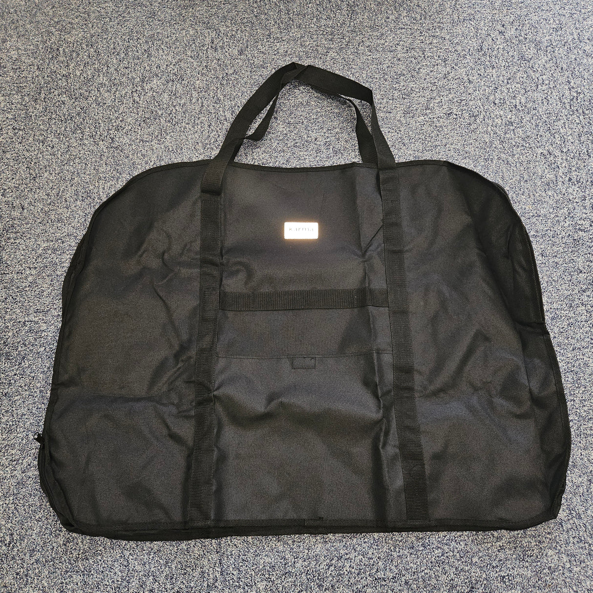 Black wheelchair bag on a gray textured surface