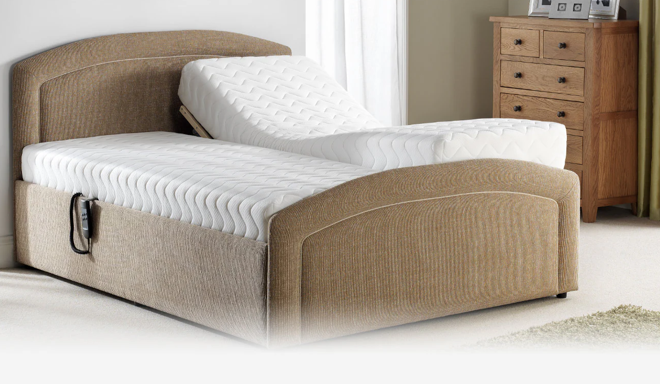 Upholstered adjustable electric bed with raised head section and supportive mattress, demonstrating comfort and positioning flexibility in modern bedroom.