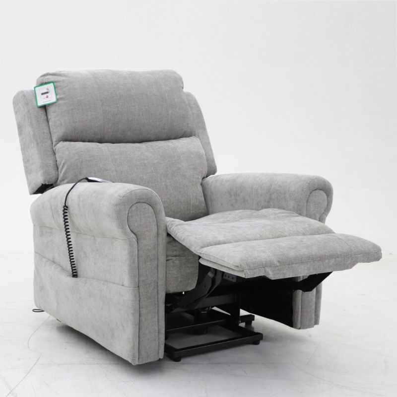 Modern large recliner chair in light grey fabric with extended footrest and remote control, designed for maximum comfort and support.