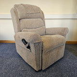 Gray recliner chair against a neutral wall