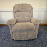 Gray recliner chair on a carpeted floor