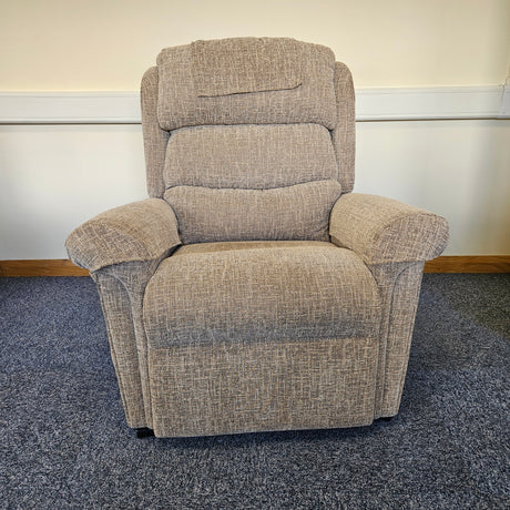 Gray recliner chair on a carpeted floor
