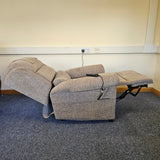 riser recliner on a carpeted floor against a white wall