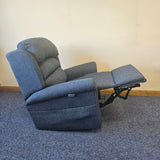 Blue recliner chair on a carpeted floor with a plain wall background