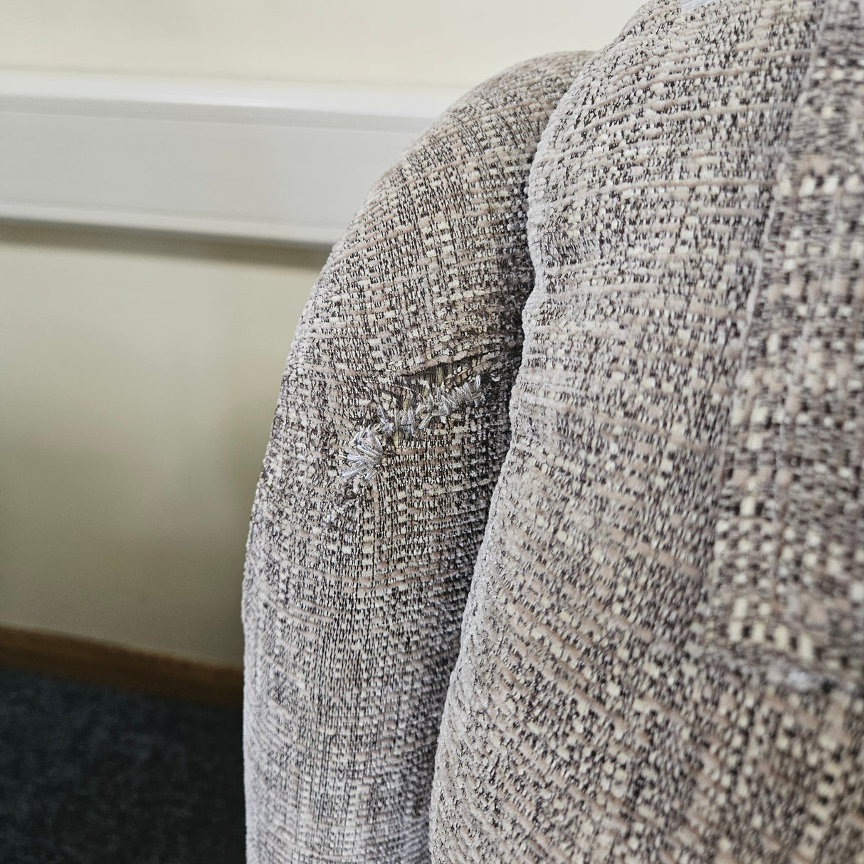 Close-up of textured fabric with a neutral colour palette.