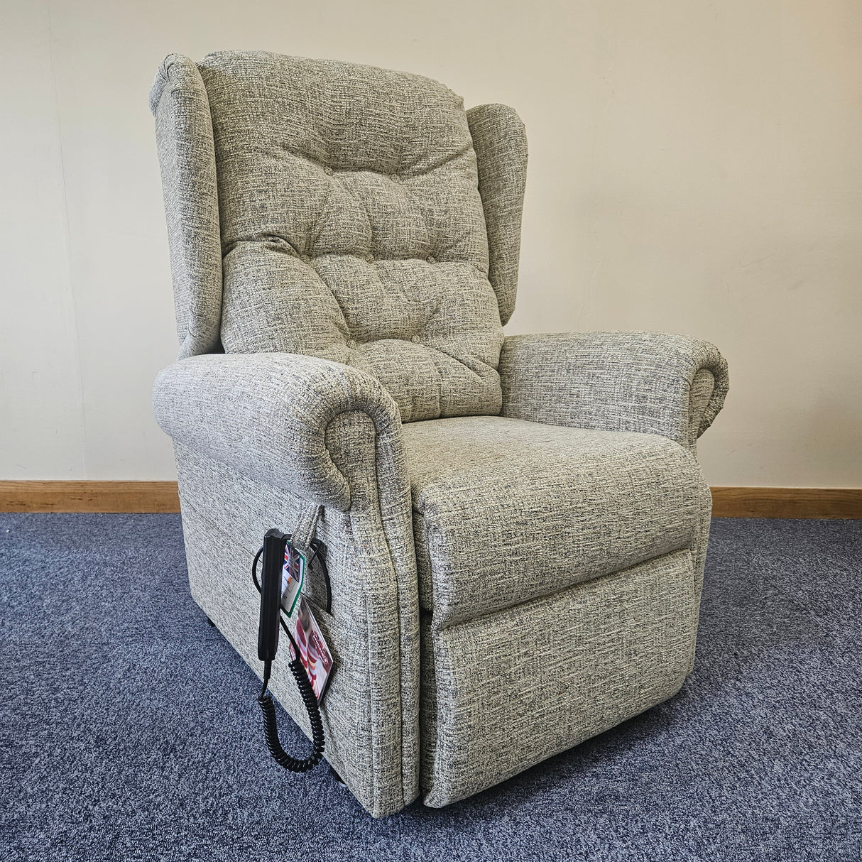 Gray recliner chair against a wall
