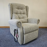 Gray recliner chair against a wall