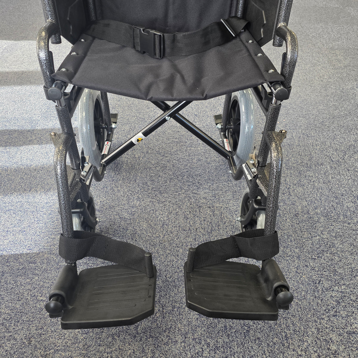 Crash tested wheelchair- Carer controlled suitable for use in a vehicle