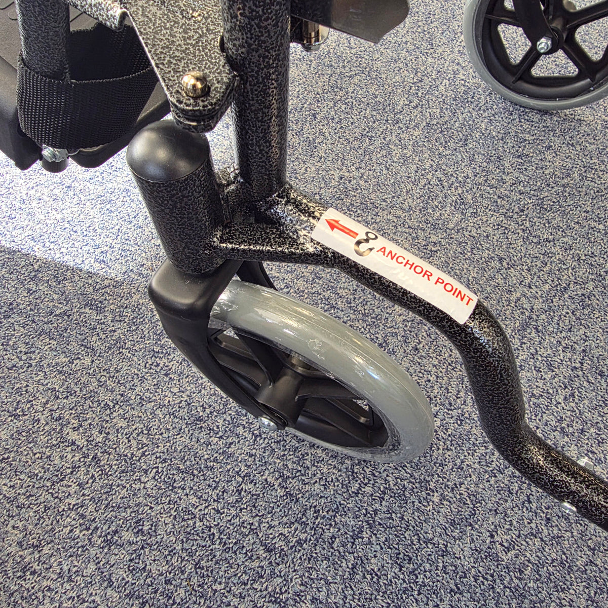 Crash tested wheelchair- Carer controlled suitable for use in a vehicle