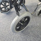 Crash tested wheelchair- Carer controlled suitable for use in a vehicle