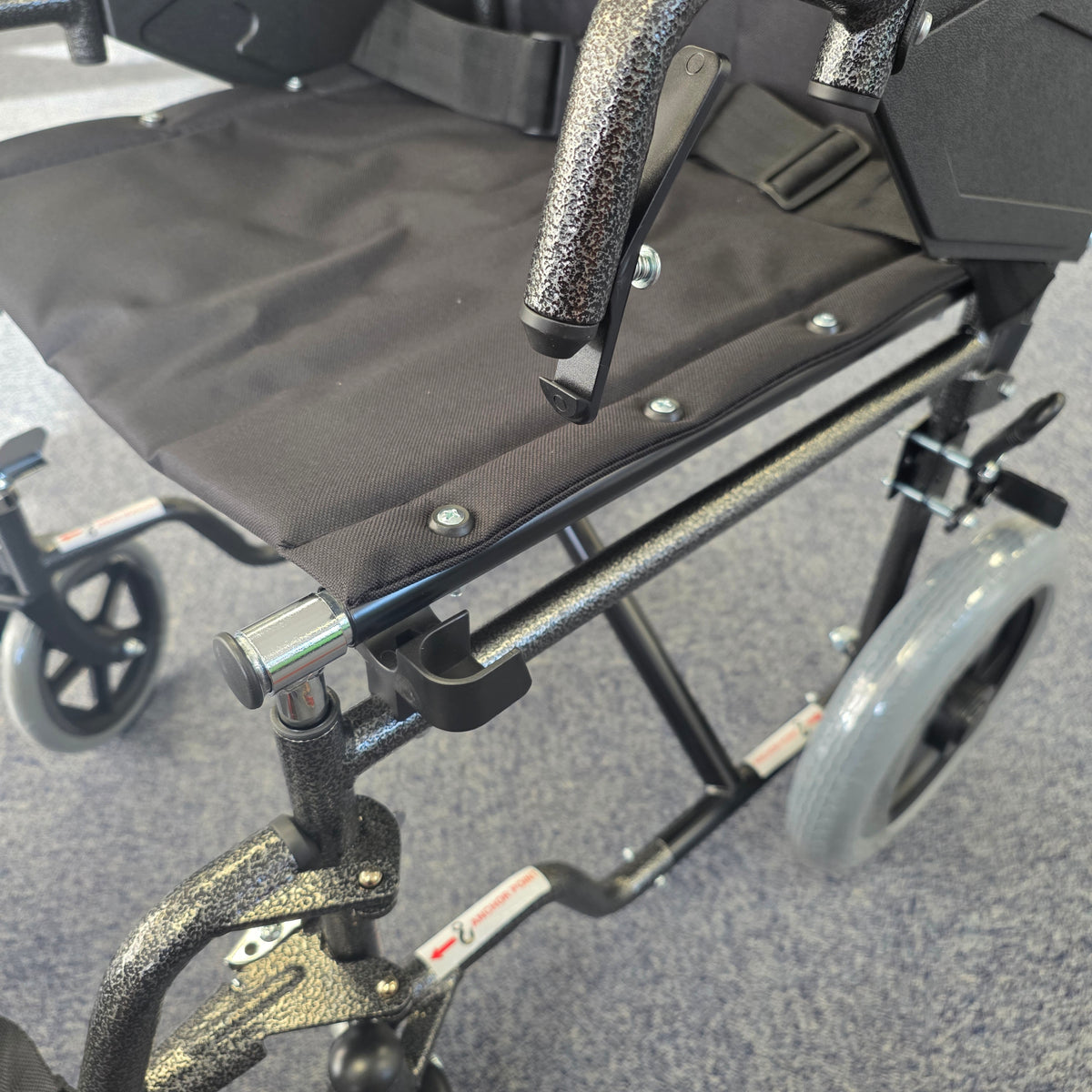 Crash tested wheelchair- Carer controlled suitable for use in a vehicle