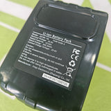 Black lithium battery pack with labels on a green background