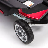 Close-up of a wheel and red footrest on a mobility scooter.