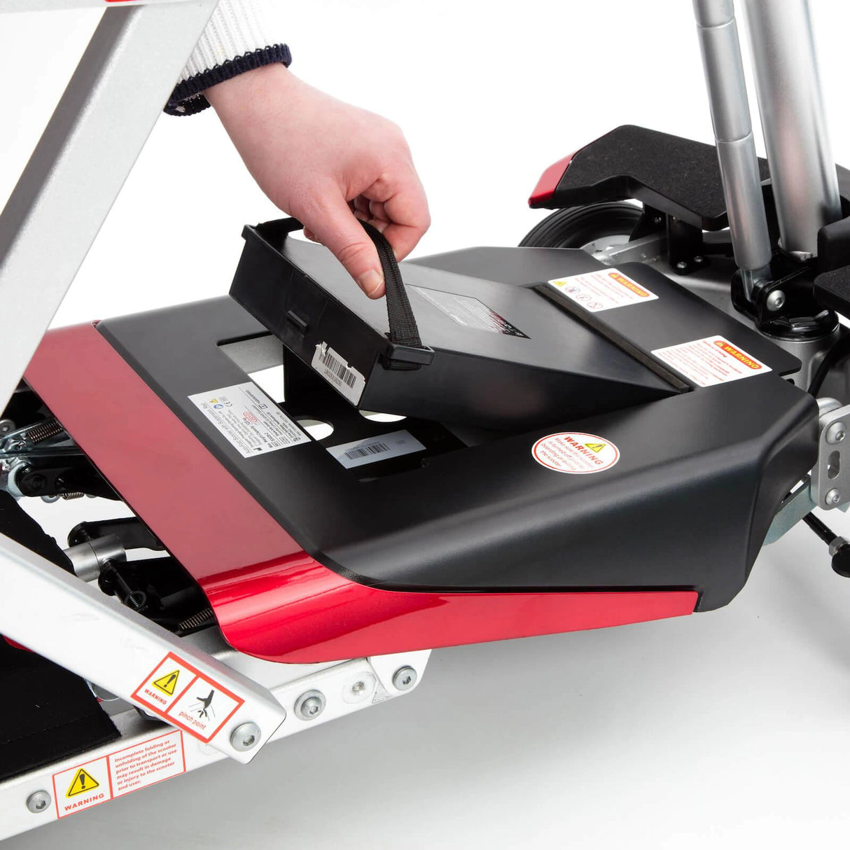 Person adjusting a scooter on a white background