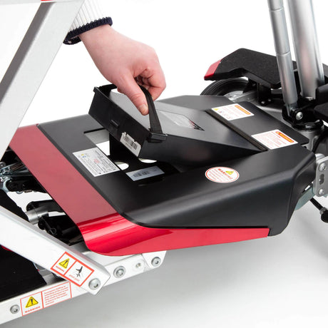 Person adjusting a scooter on a white background
