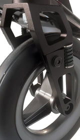 Close-up of a wheelchair wheel with suspension fork on a white background
