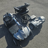 Top-down view of a mobility scooter on a concrete surface