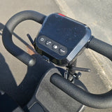Control panel with buttons on a scooter handlebar