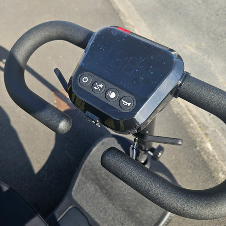 Control panel with buttons on a scooter handlebar