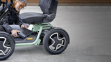 Person using a modern electric mobility scooter on a concrete surface