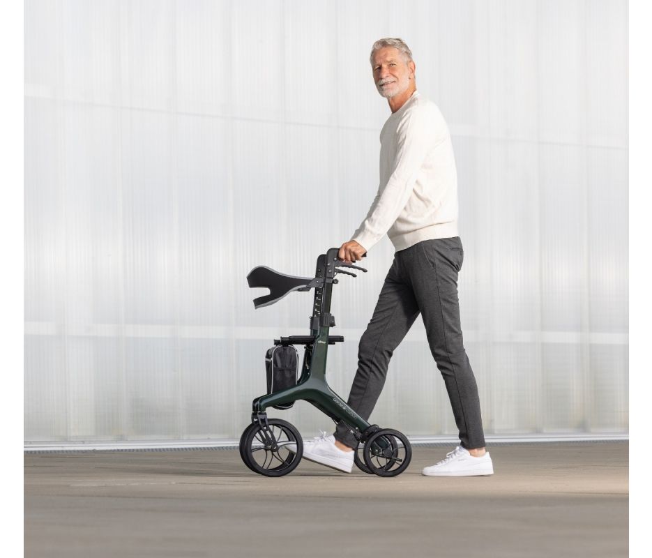 Man using a rollator in a minimalistic indoor setting