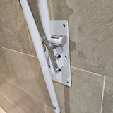 Folding drop down toilet bathroom safety rail with leg