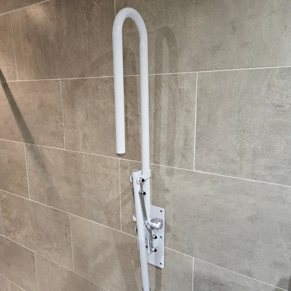 Folding drop down toilet bathroom safety rail with leg