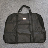 Black wheelchair bag on a gray textured surface