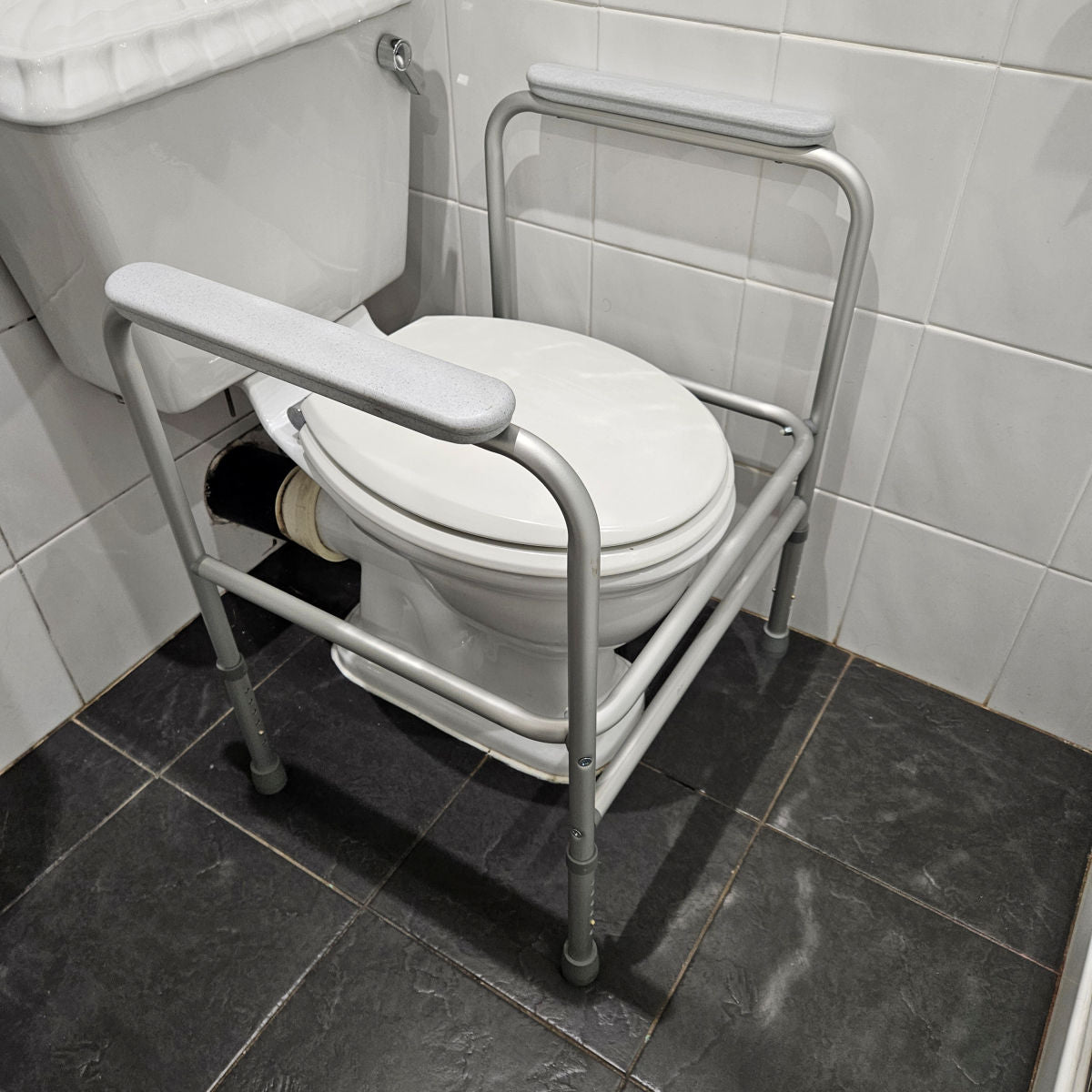 Toilet surround safety frame mobility aid with armrests - Height adjustable