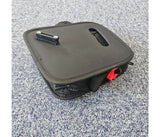 Black rollator bag on a textured gray surface