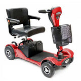 Red mobility scooter with black seat and basket on a white background